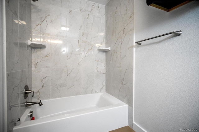 404 S Oneida Way, Denver, CO 80224 - bathroom featuring  shower combination and a textured wall