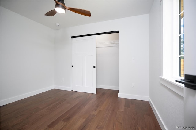 404 S Oneida Way, Denver, CO 80224 - unfurnished bedroom with wood finished floors, a closet, and a ceiling fan