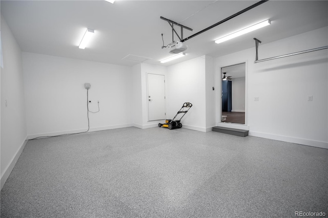 404 S Oneida Way, Denver, CO 80224 - garage with baseboards and a garage door opener
