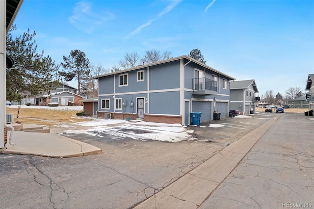 back of house featuring a garage