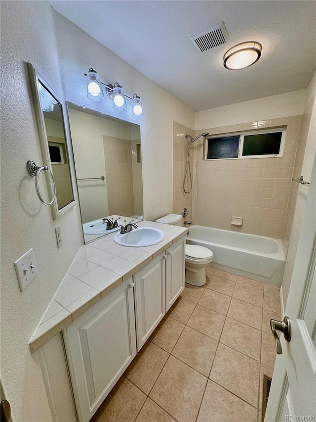 bathroom with visible vents, toilet, shower / bathtub combination, tile patterned flooring, and vanity