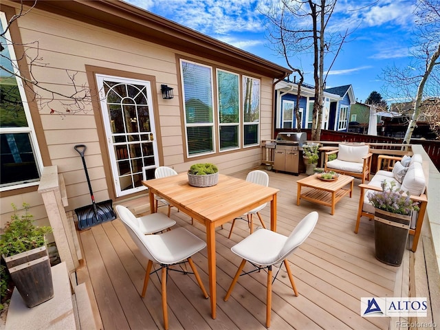 wooden terrace with outdoor dining area and an outdoor living space