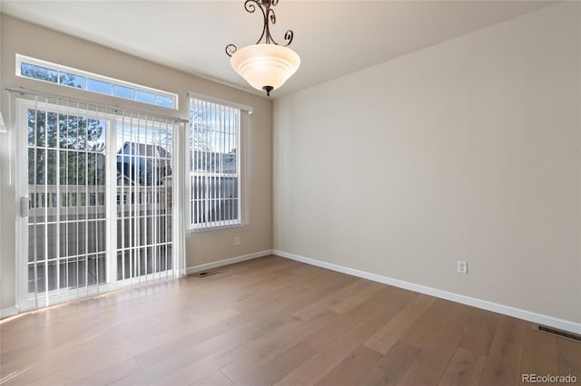 spare room with light wood-type flooring