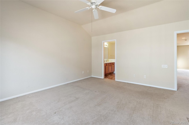 spare room with light colored carpet, ceiling fan, and lofted ceiling