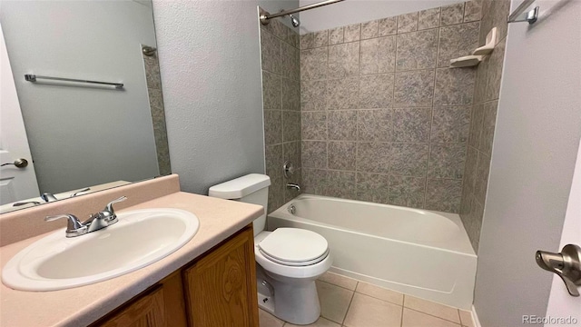 full bath with shower / bath combination, tile patterned floors, vanity, and toilet