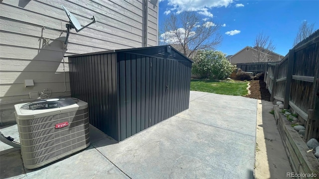 exterior space with a fenced backyard and cooling unit