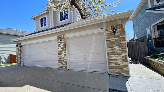 garage featuring driveway