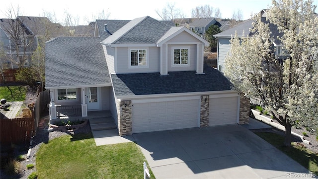 traditional home featuring a garage, stone siding, a shingled roof, a porch, and driveway