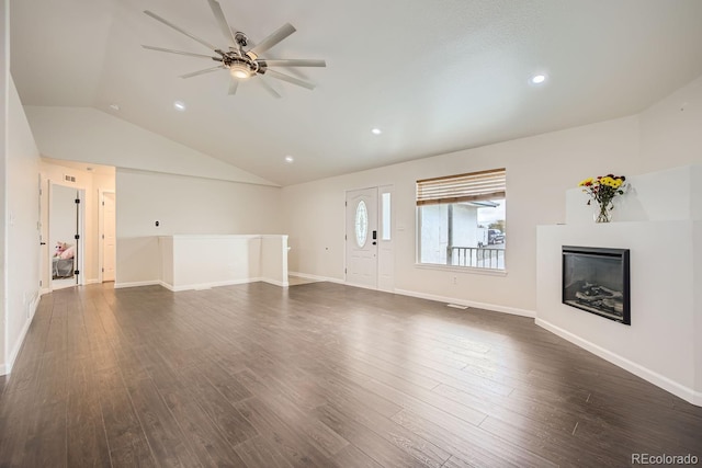 unfurnished living room with lofted ceiling, ceiling fan, and dark hardwood / wood-style floors