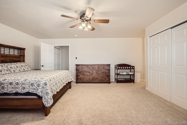 carpeted bedroom with ceiling fan