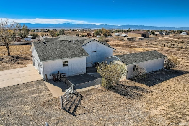 drone / aerial view featuring a mountain view