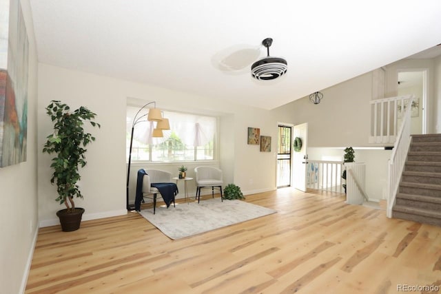 4302 Nepal St, Denver, CO 80249 - living area with wood finished floors, baseboards, and stairs