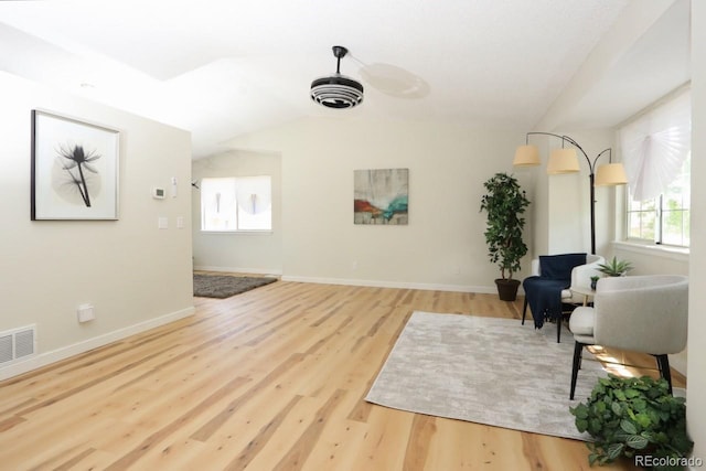 4302 Nepal St, Denver, CO 80249 - living area featuring wood finished floors, baseboards, vaulted ceiling, and ceiling fan