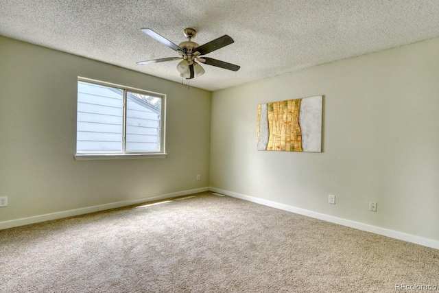 4302 Nepal St, Denver, CO 80249 - spare room featuring carpet floors, a textured ceiling, a ceiling fan, and baseboards