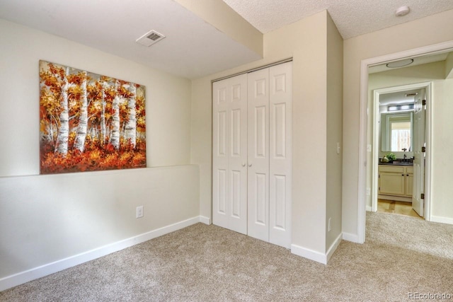 4302 Nepal St, Denver, CO 80249 - unfurnished bedroom featuring carpet flooring, a closet, and baseboards
