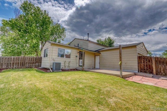 4302 Nepal St, Denver, CO 80249 - rear view of house with central AC and a patio area