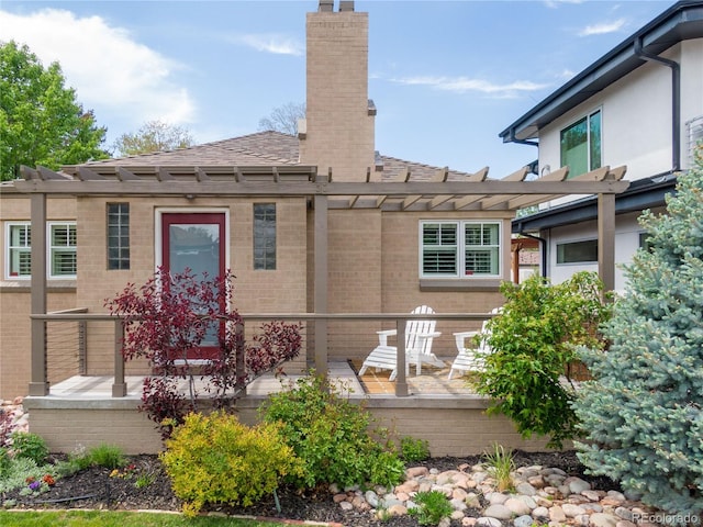 4425 Irving St, Denver, CO 80211 - rear view of house featuring brick siding, a chimney, a pergola, and roof with shingles