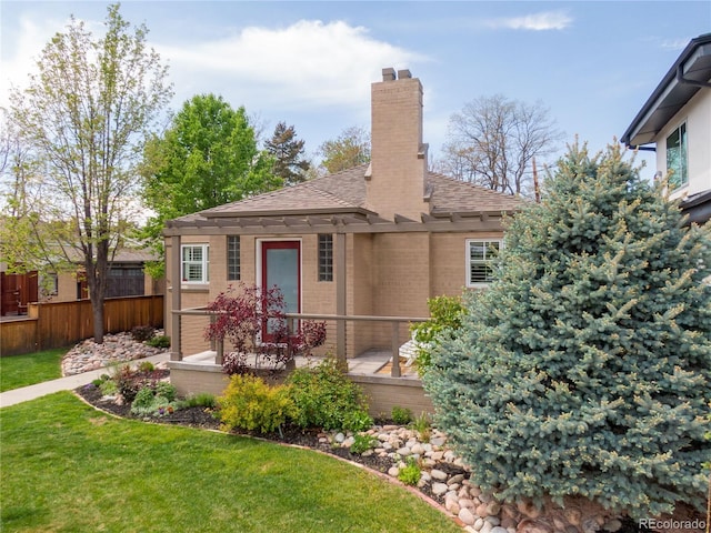 4425 Irving St, Denver, CO 80211 - view of front of house featuring a shingled roof, a chimney, and brick siding