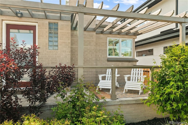 4425 Irving St, Denver, CO 80211 - view of exterior entry featuring a pergola and brick siding