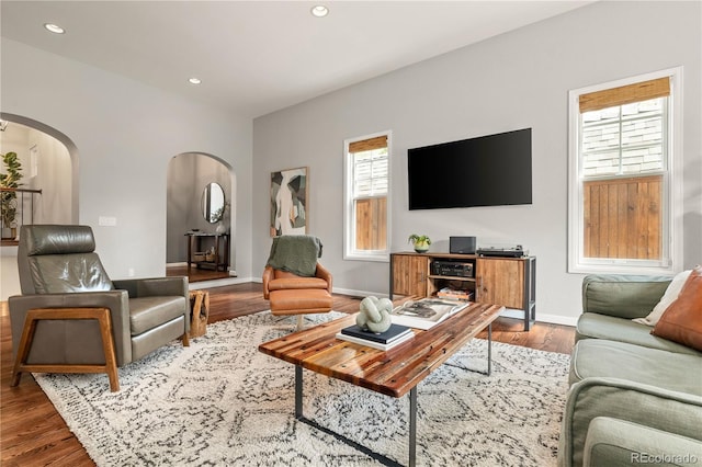 4425 Irving St, Denver, CO 80211 - living room featuring arched walkways, wood finished floors, recessed lighting, and baseboards