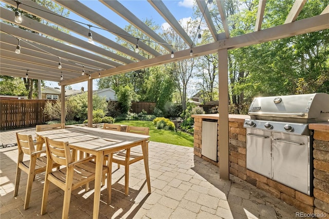 4425 Irving St, Denver, CO 80211 - view of patio featuring a fenced backyard, outdoor dining area, area for grilling, and a pergola