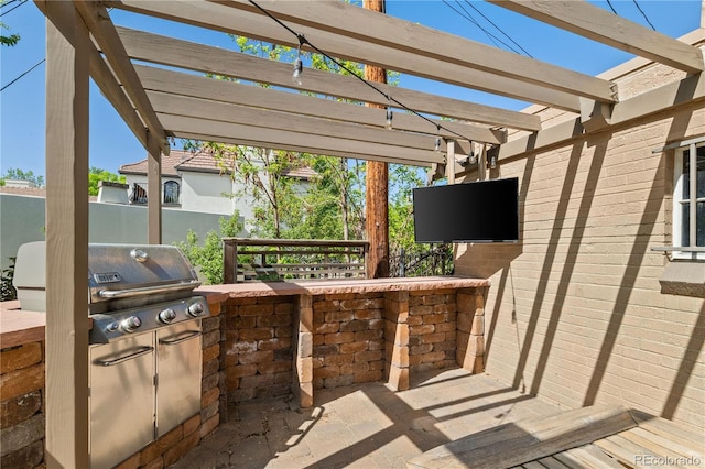 4425 Irving St, Denver, CO 80211 - view of patio / terrace with an outdoor kitchen, a grill, a pergola, and fence
