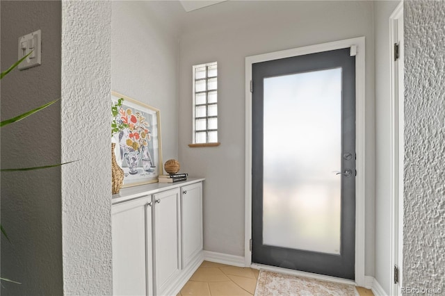 4425 Irving St, Denver, CO 80211 - doorway featuring baseboards and light tile patterned flooring
