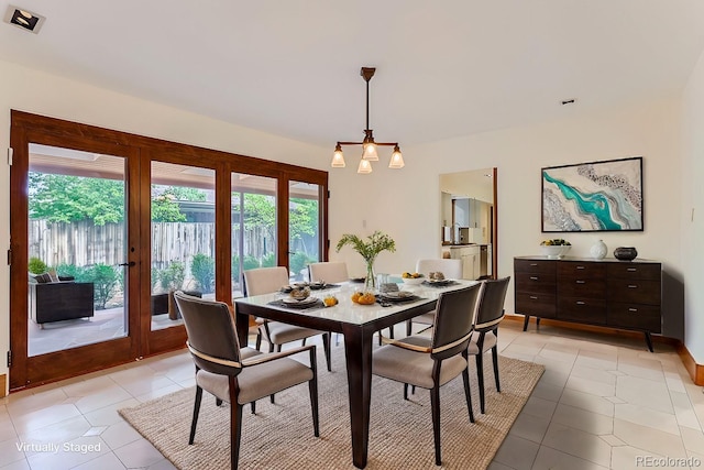 dining room with sink, french doors, and light tile patterned flooring