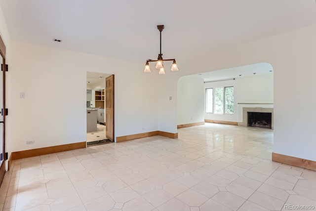 unfurnished living room featuring light tile patterned floors