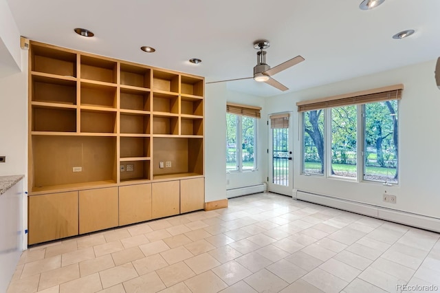 interior space featuring ceiling fan, light tile patterned floors, and a baseboard heating unit