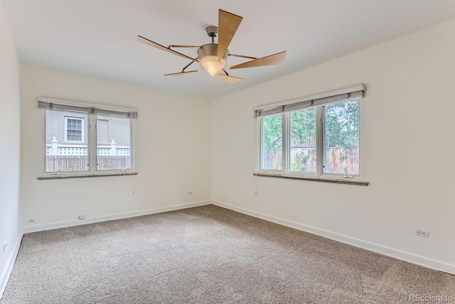 carpeted empty room with ceiling fan