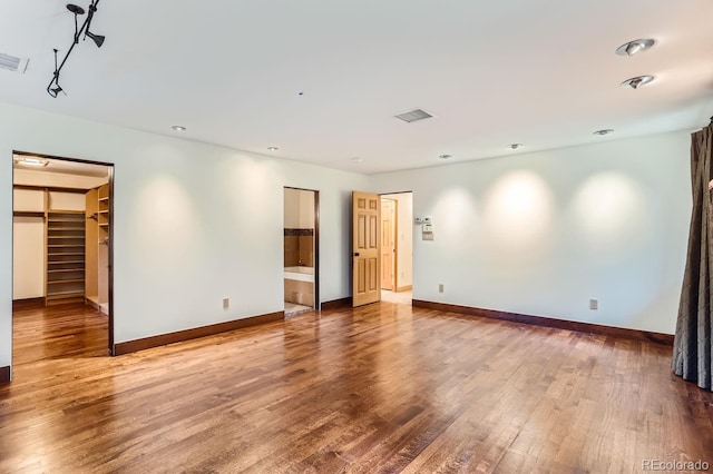 unfurnished room featuring hardwood / wood-style floors