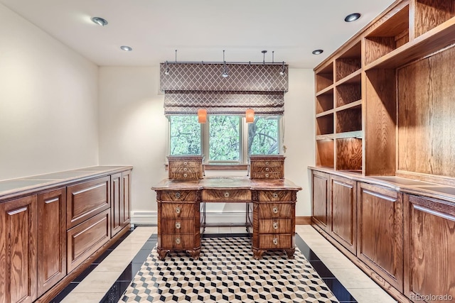 office space featuring a baseboard heating unit and light tile patterned floors