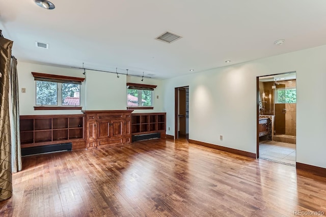 unfurnished living room with light wood-type flooring