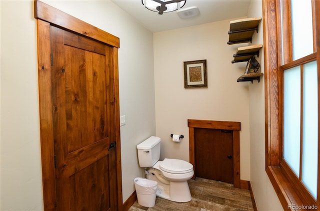 302 N Main St, Breckenridge, CO 80424 - half bathroom with toilet, wood finished floors, plenty of natural light, and baseboards