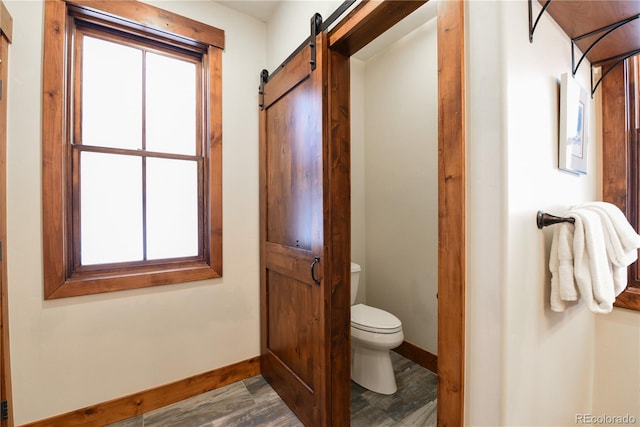 302 N Main St, Breckenridge, CO 80424 - bathroom featuring toilet, baseboards, and wood finished floors