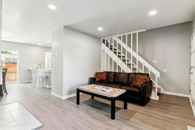 1927 S Peoria St, Aurora, CO 80014 - living area with stairs, wood finished floors, and recessed lighting