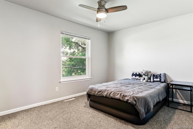 1927 S Peoria St, Aurora, CO 80014 - carpeted bedroom with baseboards and a ceiling fan