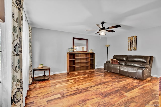 13624 Omega Cir, Lone Tree, CO 80124 - living room with ceiling fan, wood finished floors, and baseboards