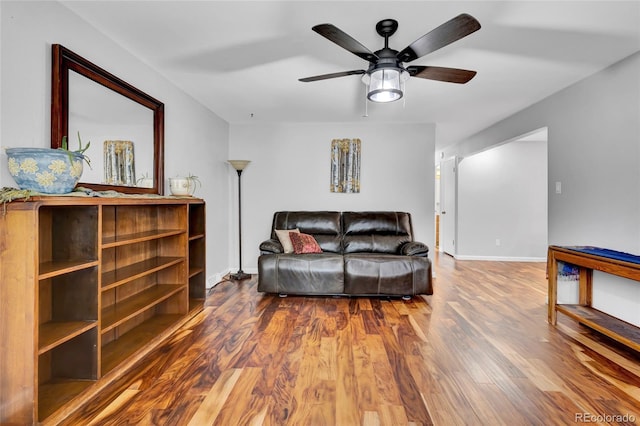 13624 Omega Cir, Lone Tree, CO 80124 - living area with a ceiling fan, wood finished floors, and baseboards