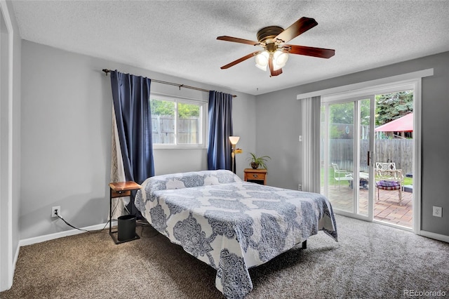 13624 Omega Cir, Lone Tree, CO 80124 - carpeted bedroom with access to exterior, multiple windows, a textured ceiling, baseboards, and ceiling fan