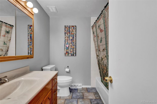 13624 Omega Cir, Lone Tree, CO 80124 - full bath with vanity, toilet, stone finish floors, shower / bath combo, and baseboards