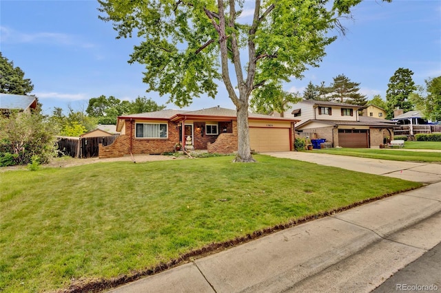 13624 Omega Cir, Lone Tree, CO 80124 - view of front of house with brick siding, concrete driveway, and a garage