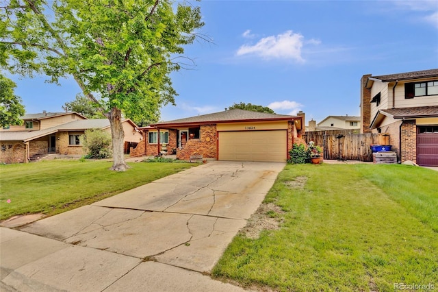 13624 Omega Cir, Lone Tree, CO 80124 - view of front of house featuring a garage, brick siding, and concrete driveway