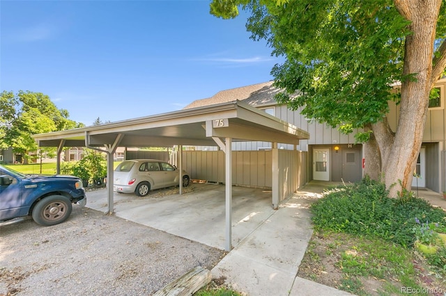 view of vehicle parking featuring a carport