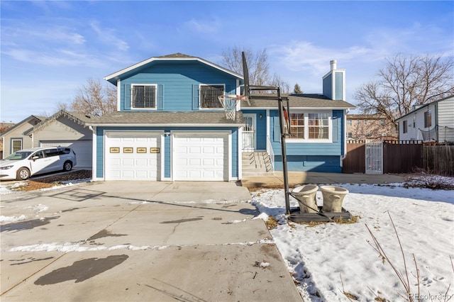 split level home featuring a garage