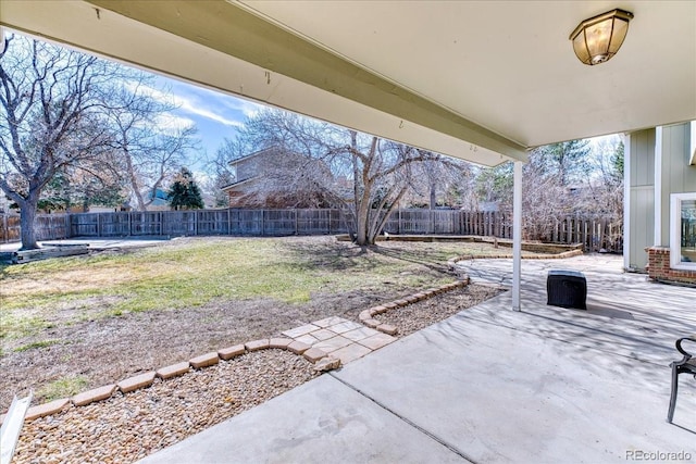 7118 W Elmhurst Ave, Littleton, CO 80128 - fenced backyard featuring a patio area