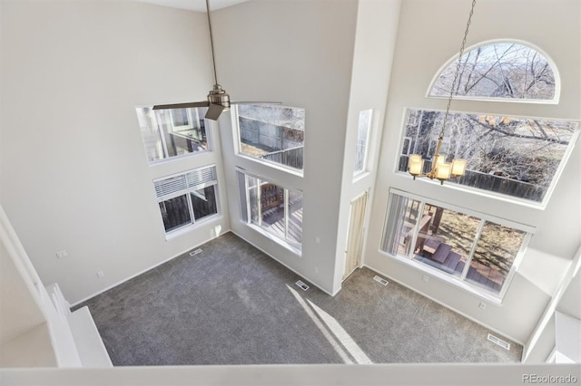 room details featuring carpet floors and visible vents