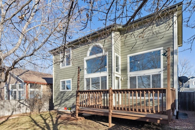 back of house featuring a deck