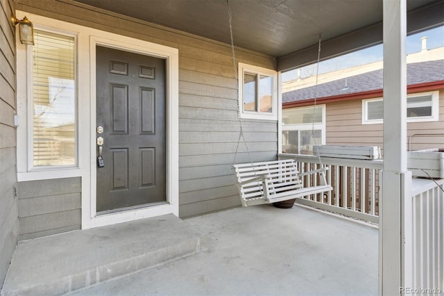 property entrance featuring a porch